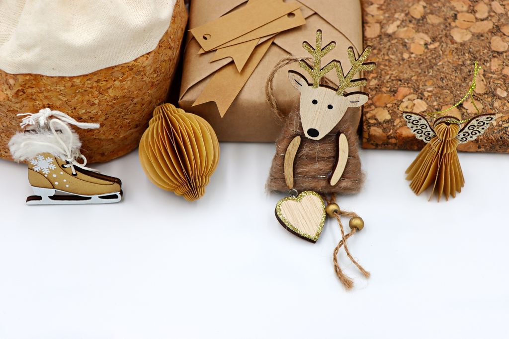 Rustic eco-friendly Christmas decorations and gifts featuring wood and paper elements.